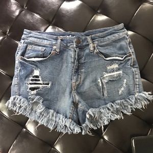 Mossino High Rise Distressed Denim Shorts